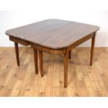 A mahogany 'D' end extendable dining table