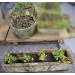 A stone composite trough garden planter; together with two others