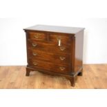 A George III style crossbanded mahogany chest of drawers