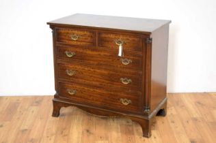 A George III style crossbanded mahogany chest of drawers