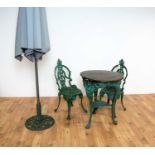 A set of Victorian style garden furniture painted in a green colourway