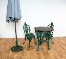 A set of Victorian style garden furniture painted in a green colourway