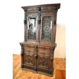 A decorative and highly carved late Victorian oak bookcase