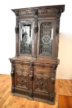 A decorative and highly carved late Victorian oak bookcase