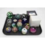 A collection of glass paperweights; and other items