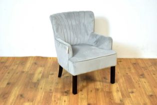 A contemporary barrel back armchair,