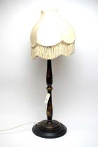 A Chinoiserie black lacquered table lamp
