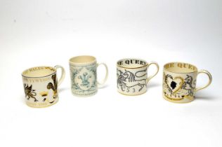 A collection of four Wedgwood Royal Commemorative mugs