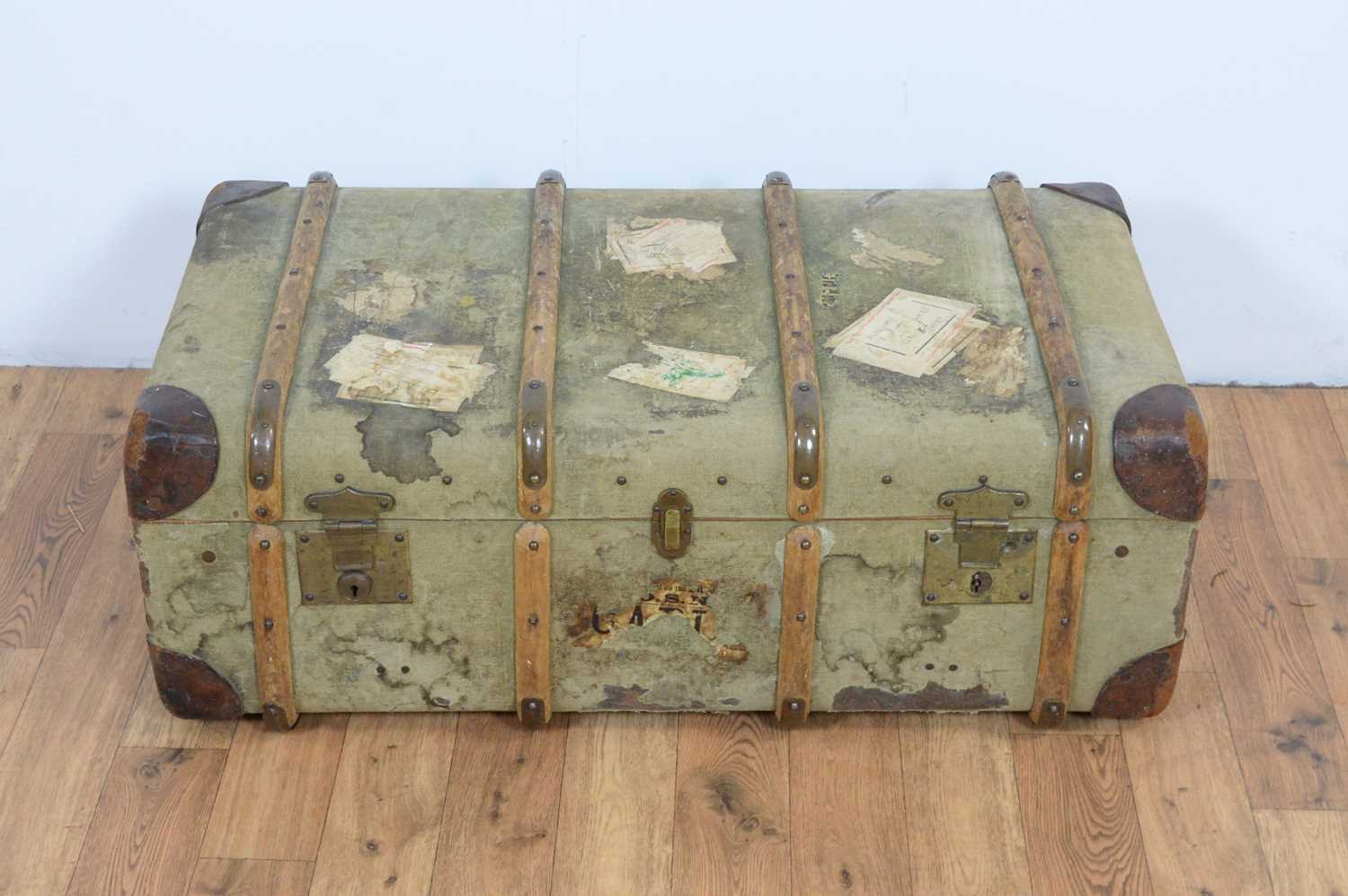 A vintage canvas steamer trunk