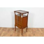 An attractive early 20th Century mahogany and cross-banded serpentine music cabinet.