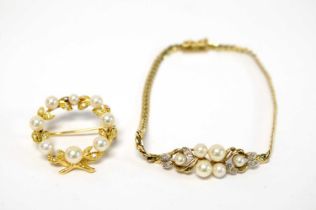 A yellow gold, cultured pearl and diamond wreath brooch and bracelet