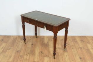 A Victorian mahogany writing table.