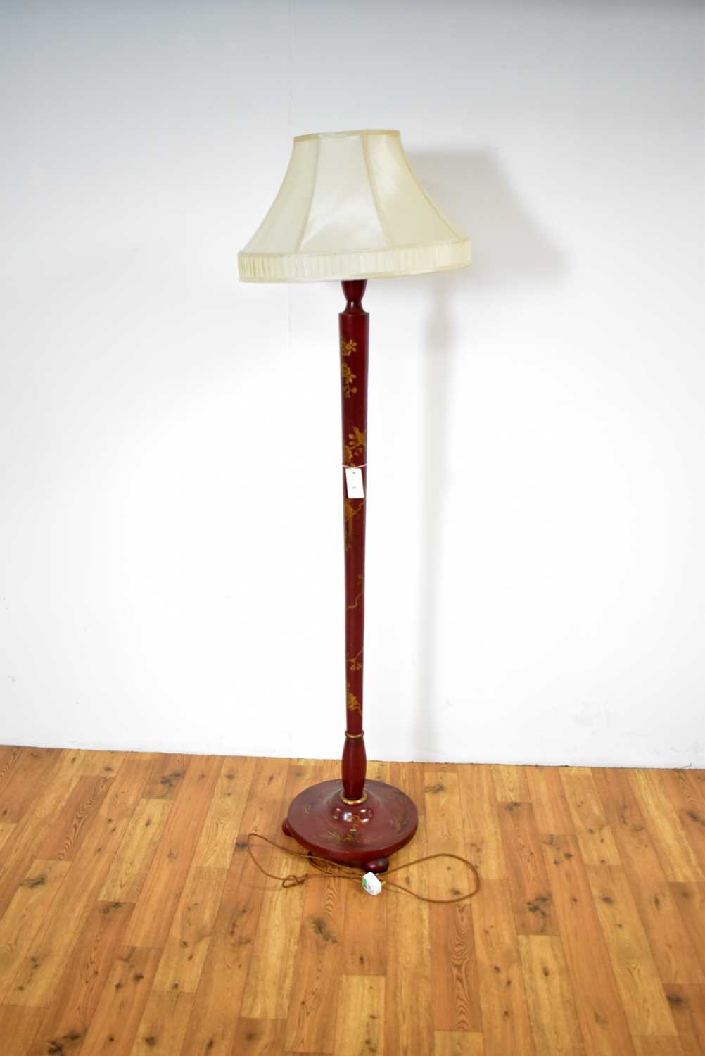 A decorative mid-20th Century red lacquered chinoiserie design standard lamp,