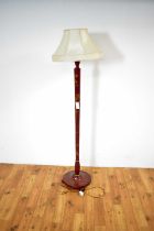 A decorative mid-20th Century red lacquered chinoiserie design standard lamp,
