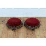 A pair of decorative carved Victorian footstools.