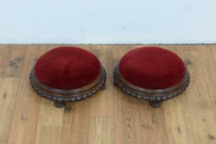 A pair of decorative carved Victorian footstools.