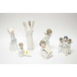 A collection of Lladro figures of cherubs