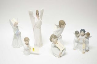 A collection of Lladro figures of cherubs