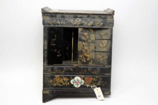 An oriental black lacquered table-top chest