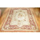 A modern Aubusson style rug,; and a modern floral needlework rug,