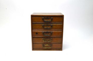 An oak tabletop specimen chest