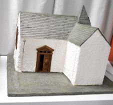 A unique scratch made model dolls house in the form of a chapel