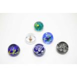 Six limited edition Caithness paperweights
