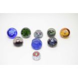 A collection of Caithness glass paperweights