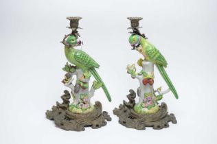 A pair of ceramic parrot candlesticks