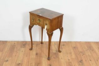 A small and attractive crossbanded burr walnut lowboy/side table in the early 18th Century taste.