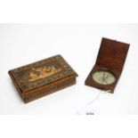 An antique pocket compass; and a cigarette box