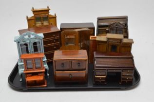 A collection of vintage stained wood dolls house furniture