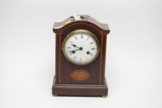 An Edwardian inlaid mahogany dome cased mantel clock