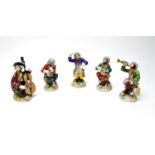 A Dresden ceramic monkey orchestra, after Meissen