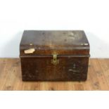 A vintage metal travelling trunk in a painted simulated wood finish.