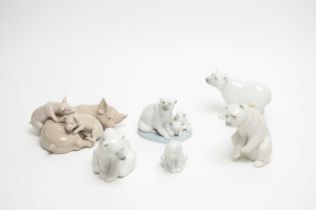 A collection of four Lladro ceramic polar bear figures