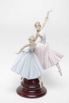 A Lladro ceramic figure group of two ballerinas
