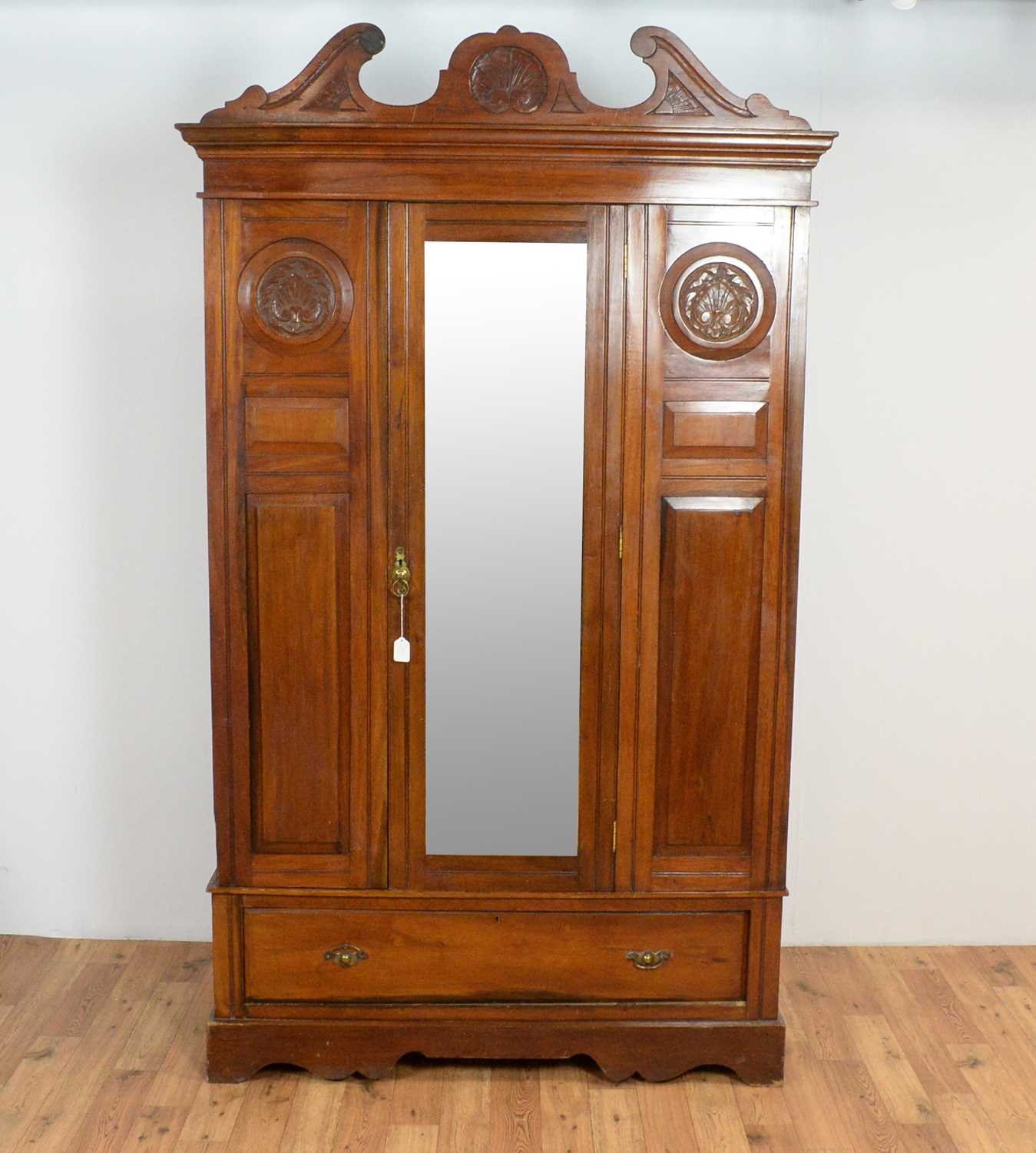 A matched Edwardian mahogany three piece bedroom suite: and a similar wardrobe (4)