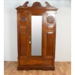 A matched Edwardian mahogany three piece bedroom suite: and a similar wardrobe (4)
