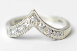 A diamond wishbone ring