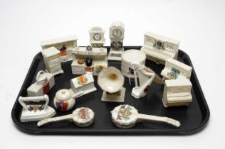 A collection of crested ceramic musical instruments and household objects
