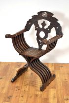 An early 20th Century carved walnut Savonarola chair