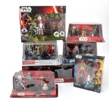 A collection of Disney Star Wars figure sets.