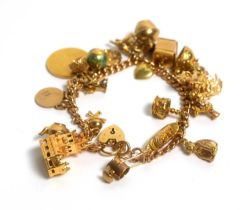 A 9ct gold bracelet set with a selection of gold and other charms