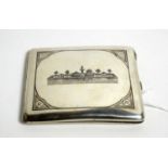 A Middle Eastern silver cigarette case with niello decoration
