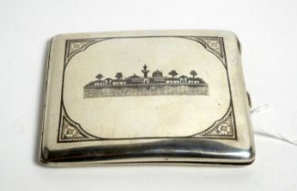 A Middle Eastern silver cigarette case with niello decoration