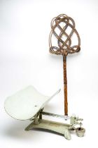 A wicker carpet beater; and a set of scales