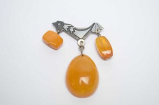 A Russian amber and silver brooch,