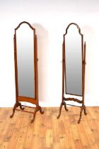 Two elegant 20th-Century mahogany cheval mirrors