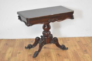 A Victorian carved mahogany tea table